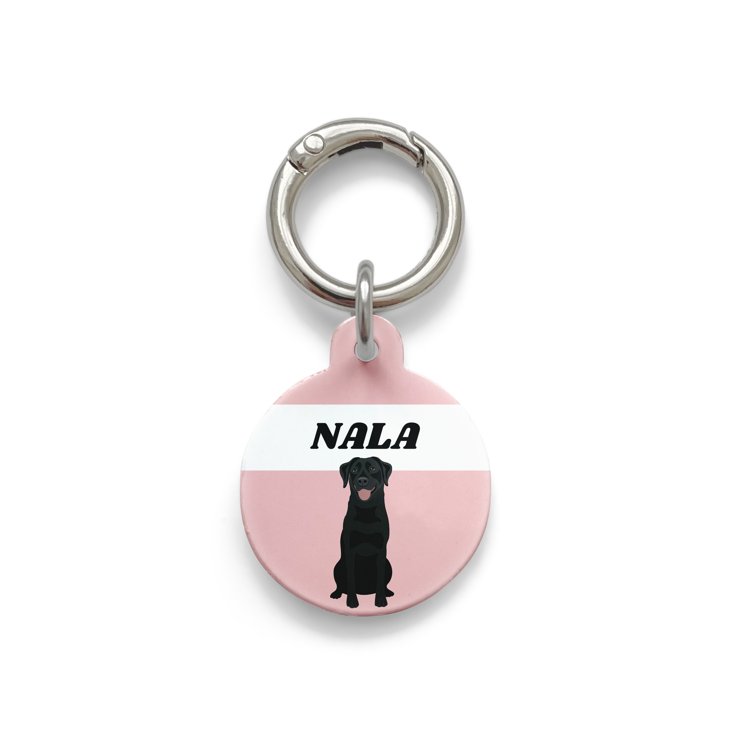 Black Labrador illustration on a circular dog ID tag with a pink background and silver ring.