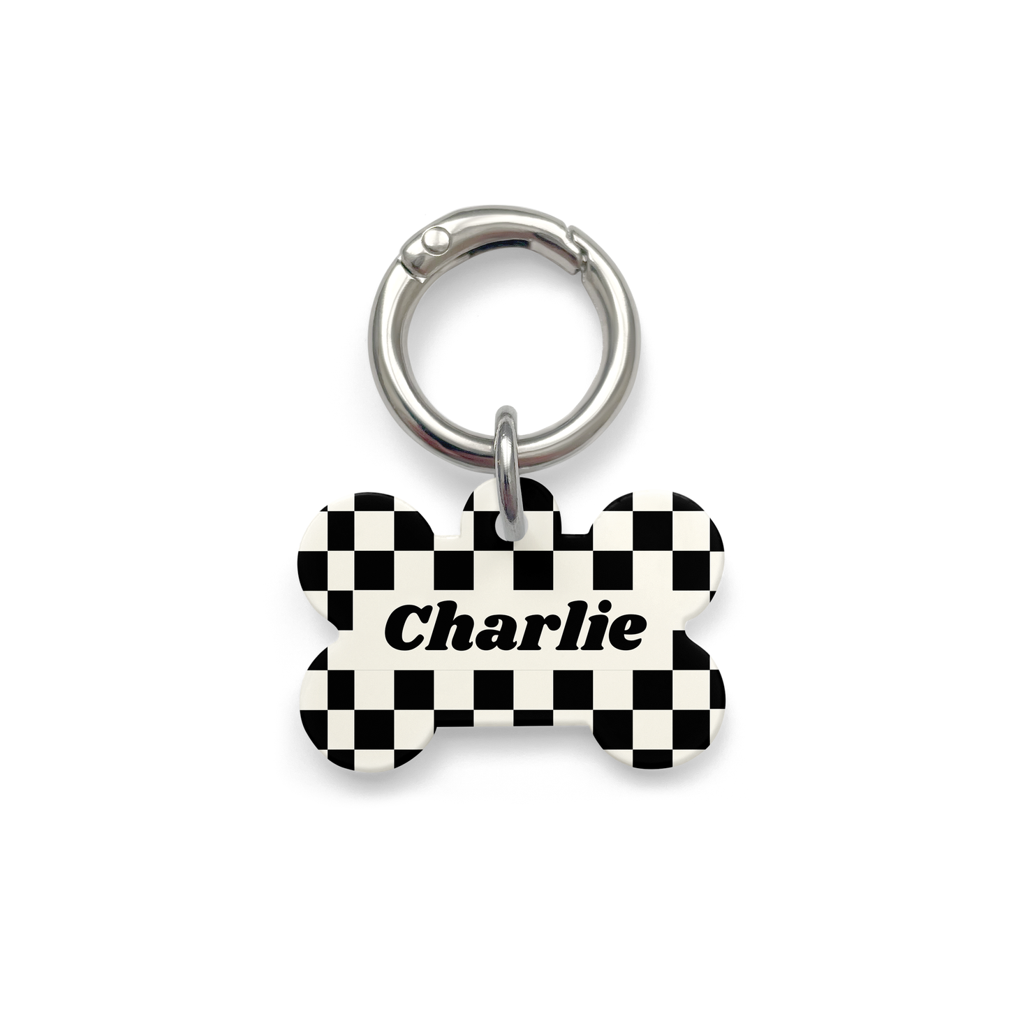 Black and white checker design Pet ID tag in a bone shape with a silver ring.