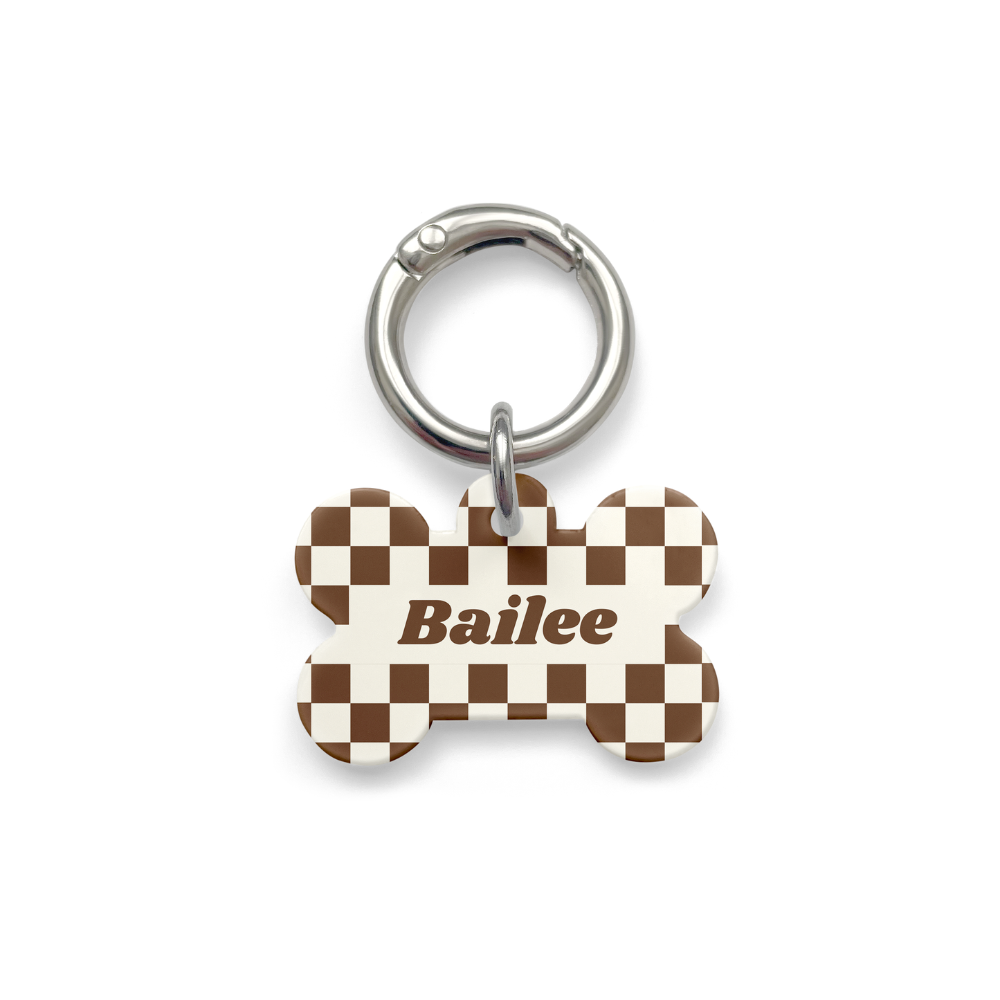 Brown and white checker Pet ID tag in a bone shape with a silver ring.