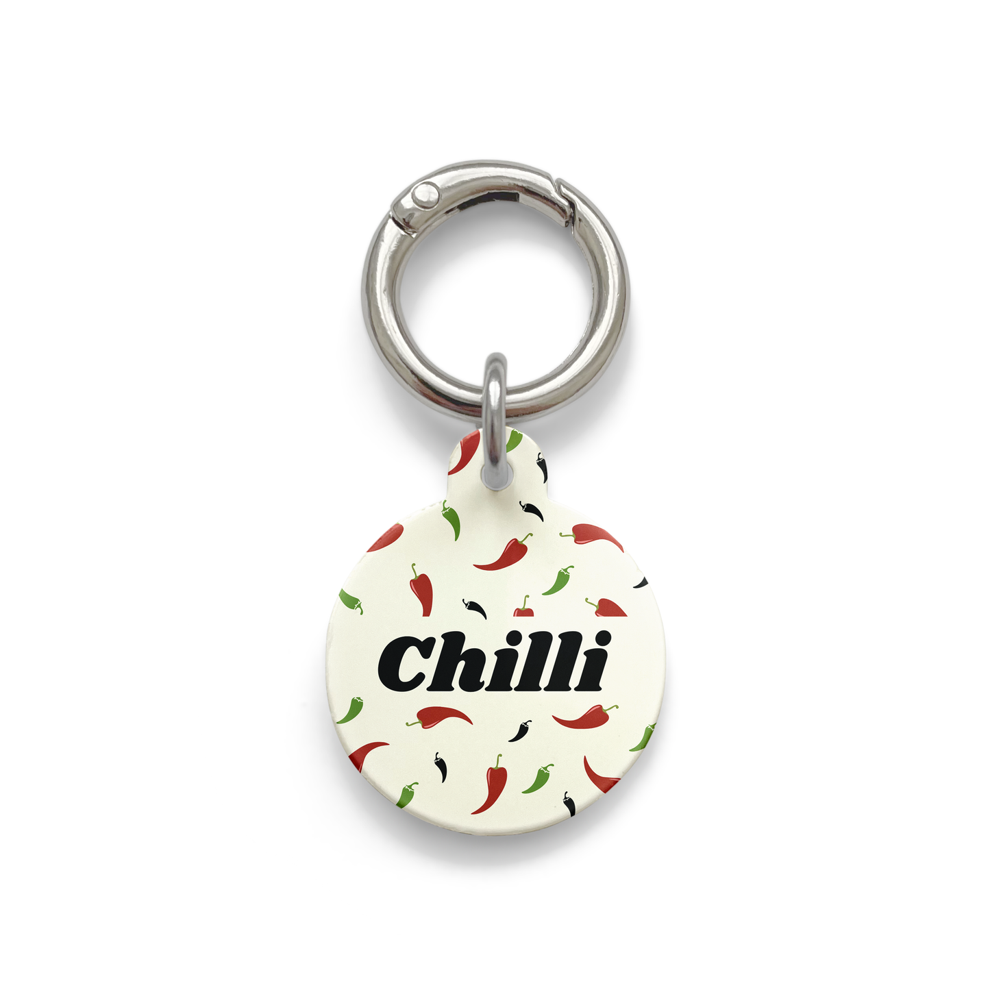 Custom pet ID tag with a design showing green red and black chillies on a circular beige background with silver ring.