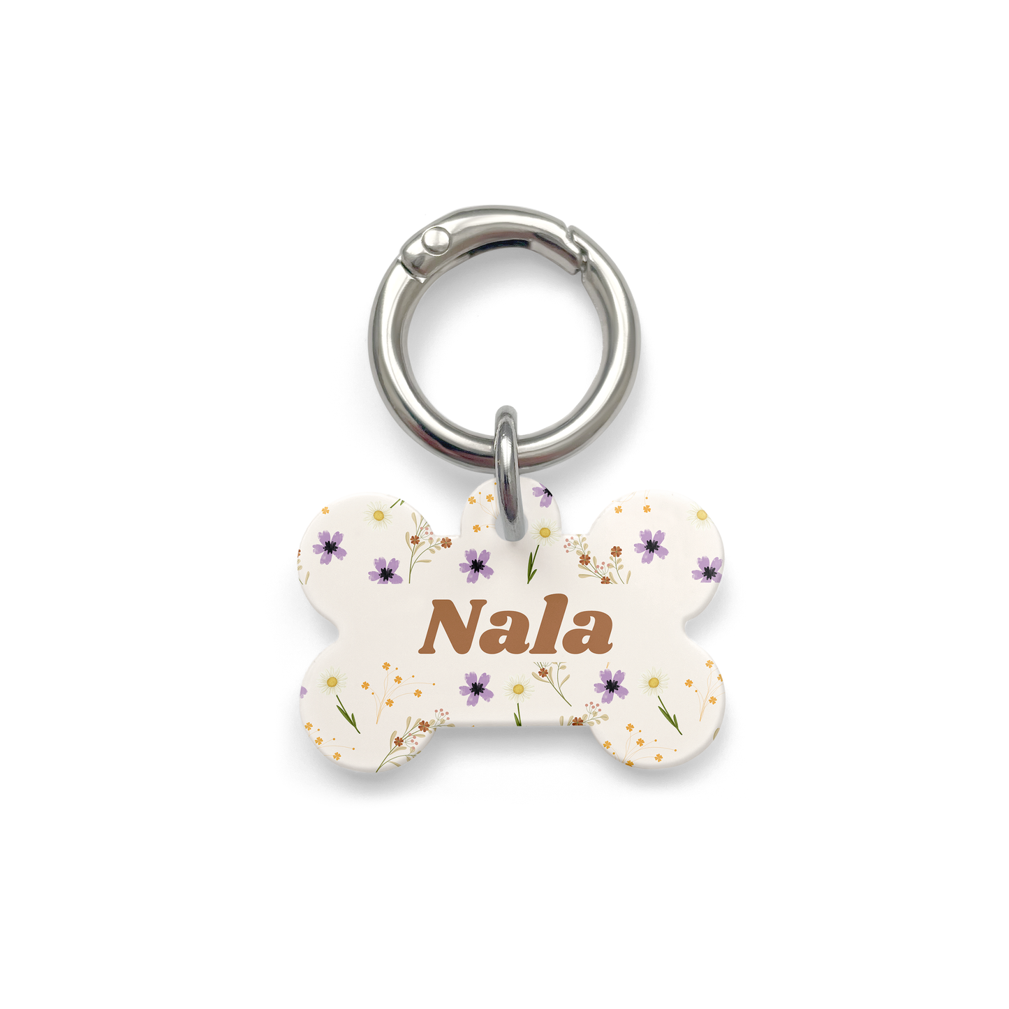 Floral pet ID tag with a design showing a range of purple, yellow and orange flowers on a bone shaped beige background with silver ring.