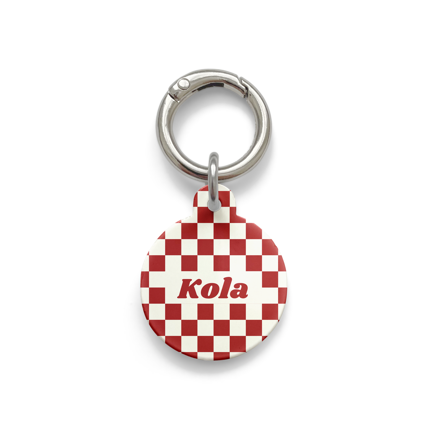 Red and white checker pattern on a Pet ID tag in a circular shape with a silver ring.