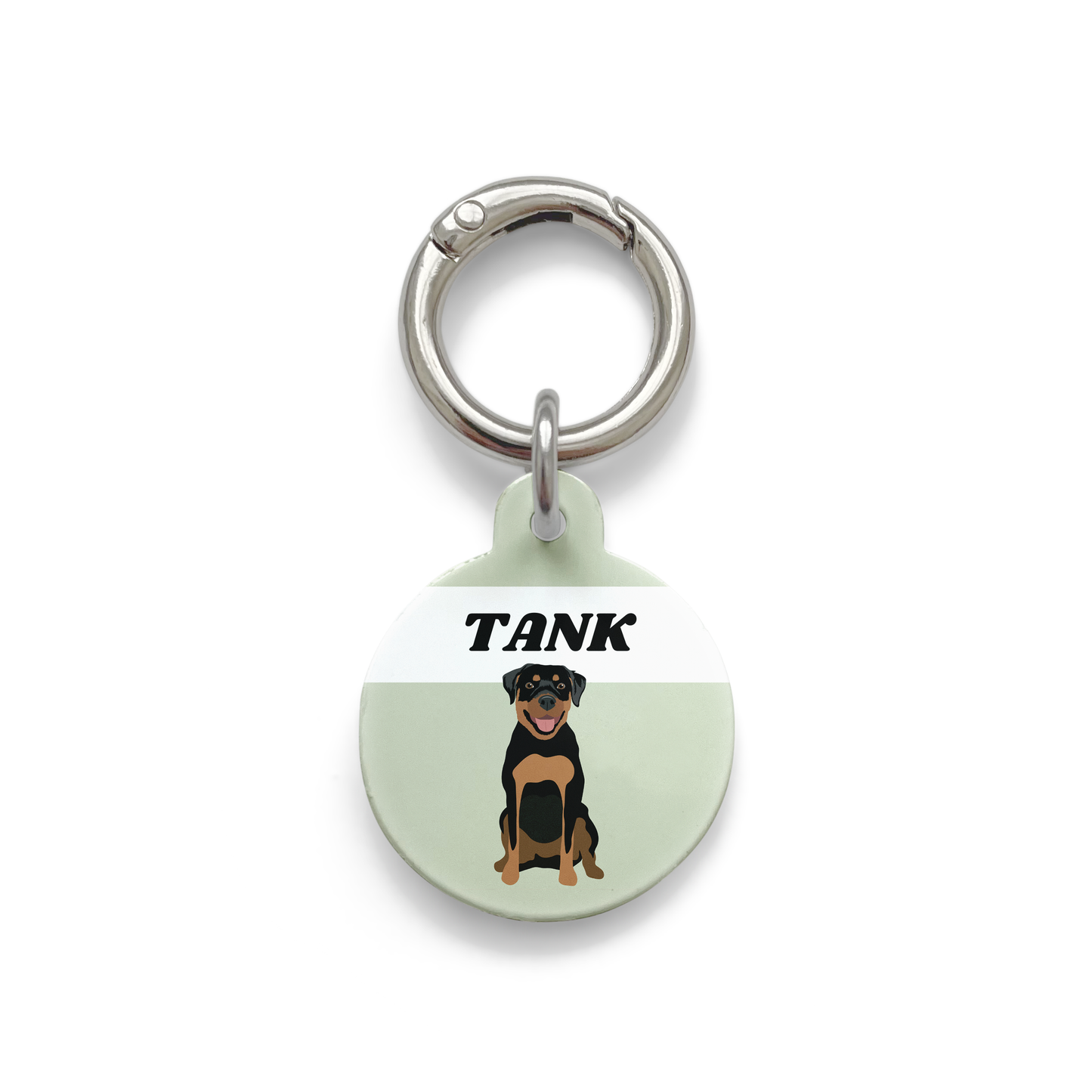 Rottweiler illustration on a circular dog ID tag with a green background and silver ring.