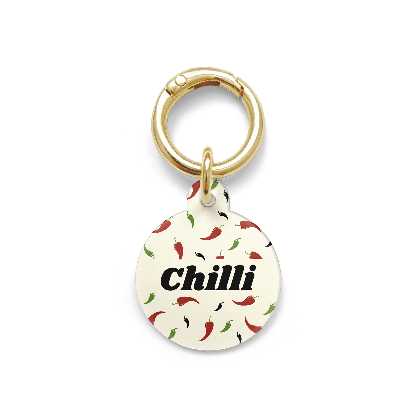 Custom pet ID tag with a design showing green red and black chillies on a circular beige background with gold ring.
