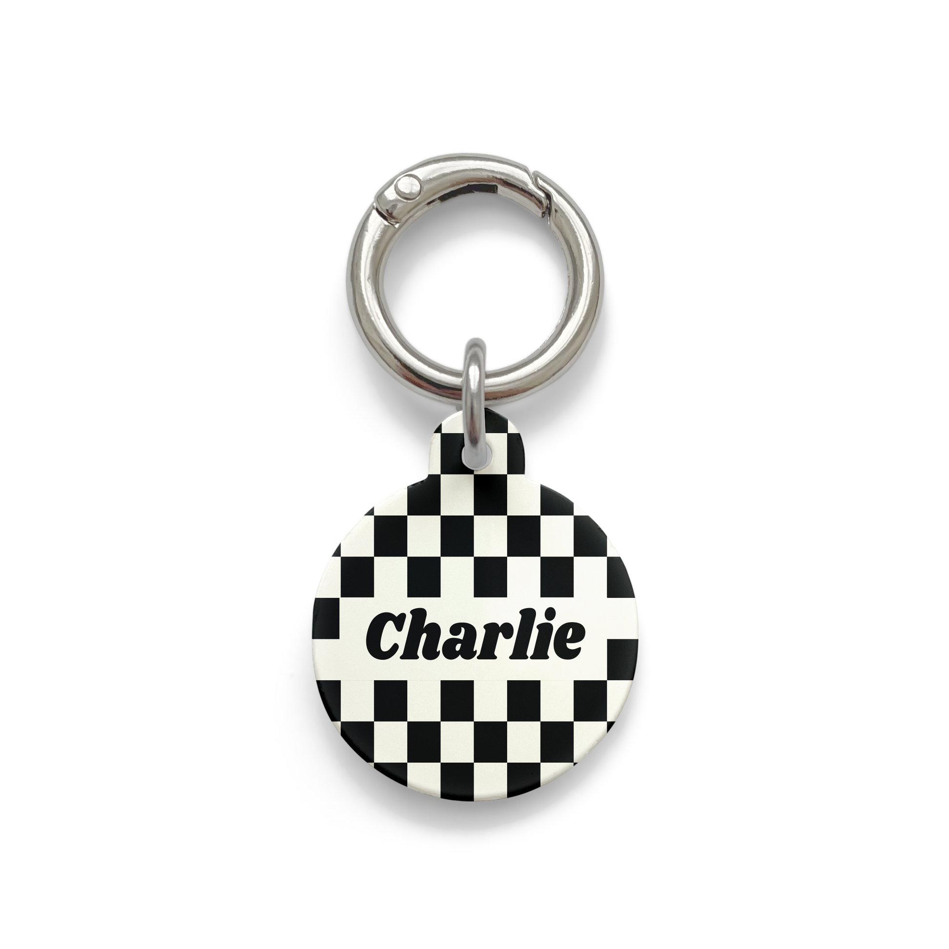 Black and white checker design Pet ID tag in a circle shape with a silver ring.