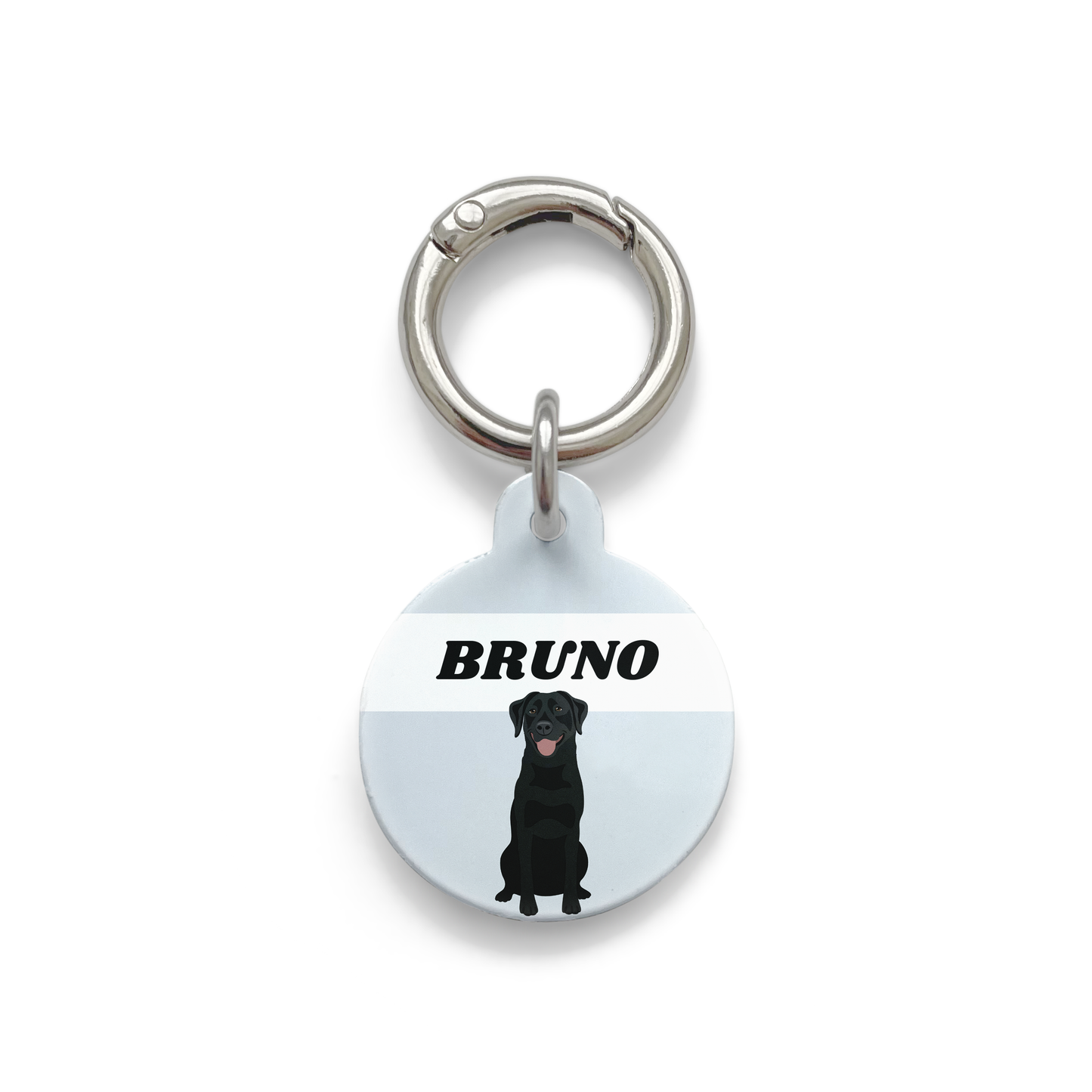 Black Labrador illustration on a circular dog ID tag with a blue background and silver ring.