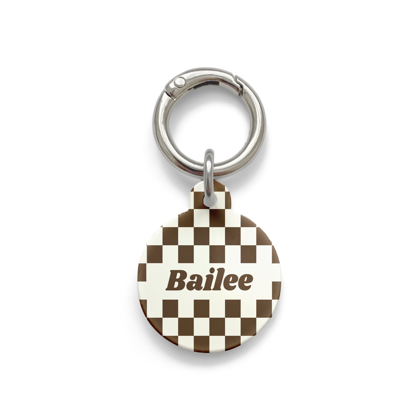 Brown and white checker Pet ID tag in a circle shape with a silver ring.