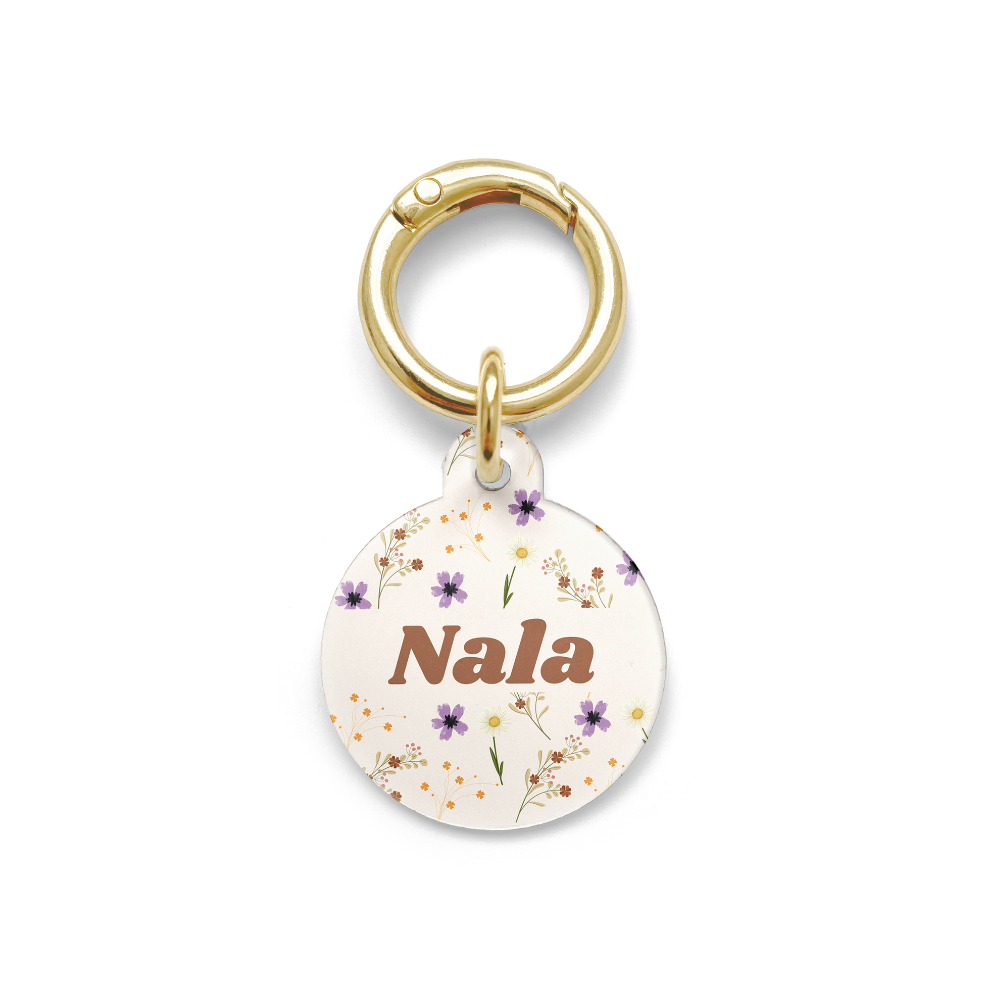 Floral pet ID tag with a design showing a range of purple, yellow and orange flowers on a beige background with gold ring.
