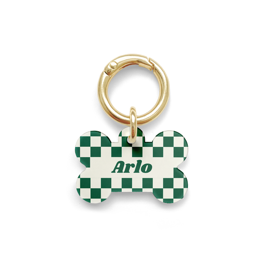 Green and white checker styled Pet ID tag in a bone shape with a gold ring. 
