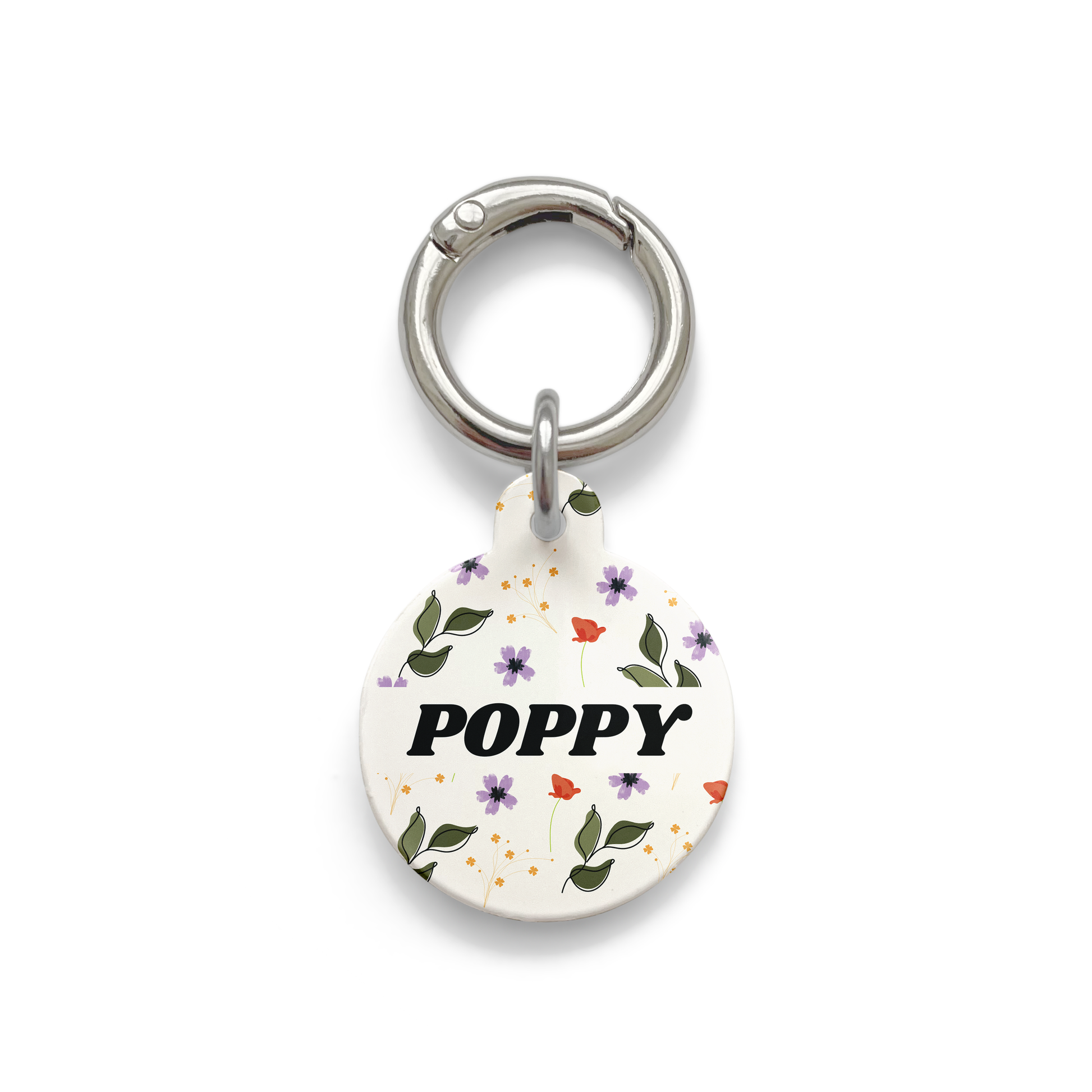 red, purple and green floral patterned pet ID tag in the circular shape with a silver ring