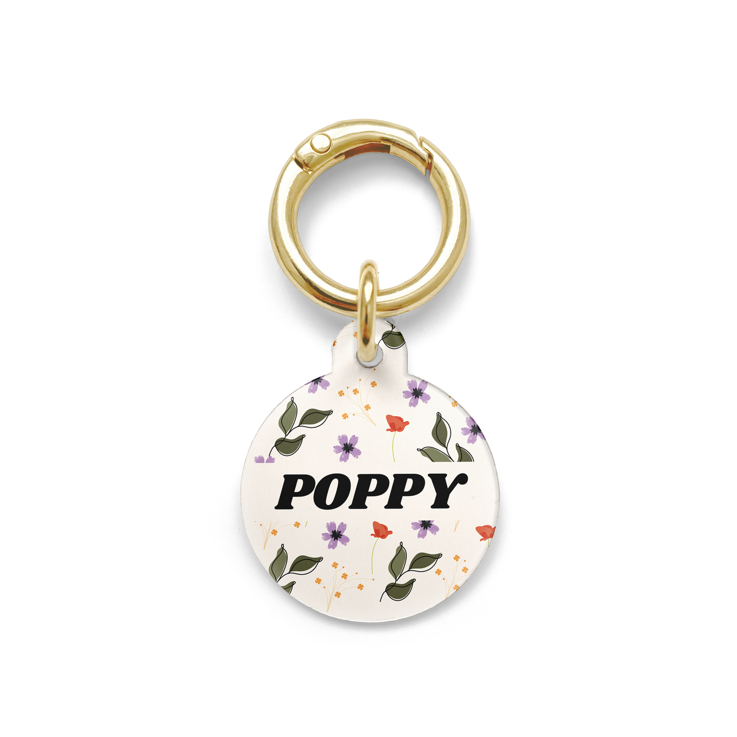 red, purple and green floral patterned pet ID tag in a circular shape with a gold ring