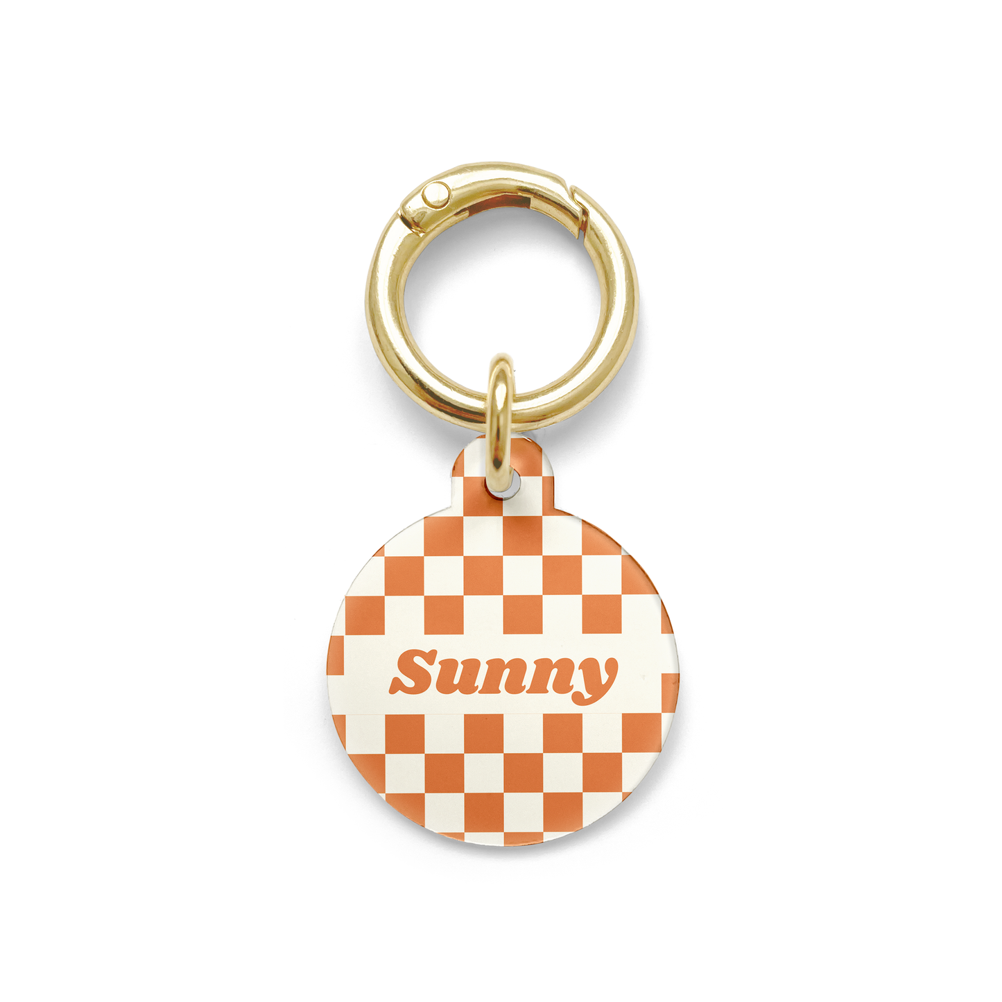 Orange and white checker styled Pet ID tag in a circular shape with a gold ring. 