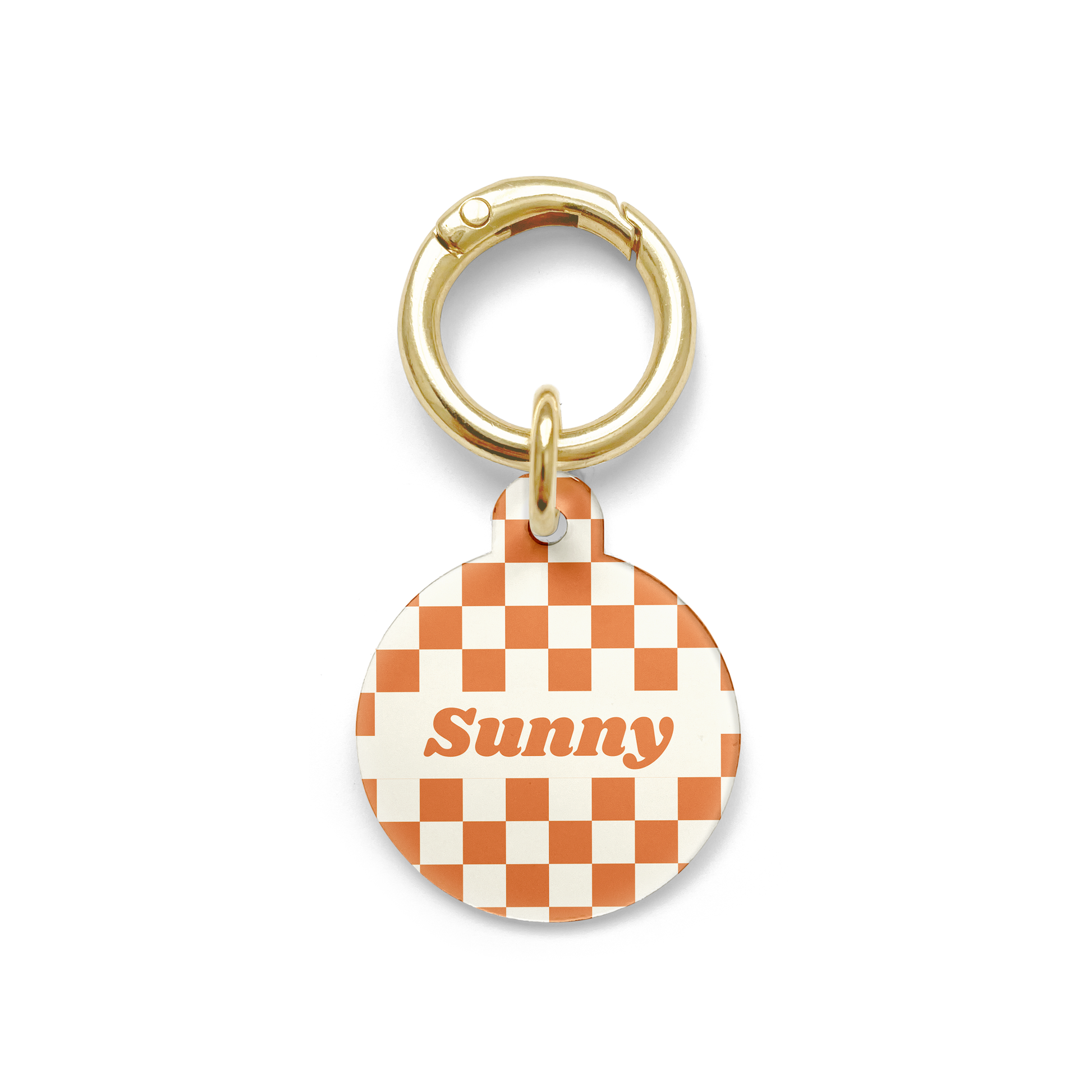 Orange and white checker styled Pet ID tag in a circular shape with a gold ring. 