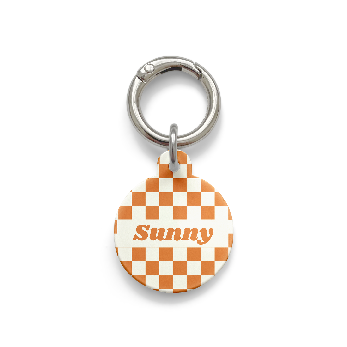 Orange and white checker styled Pet ID tag in a circular shape with a silver ring. 