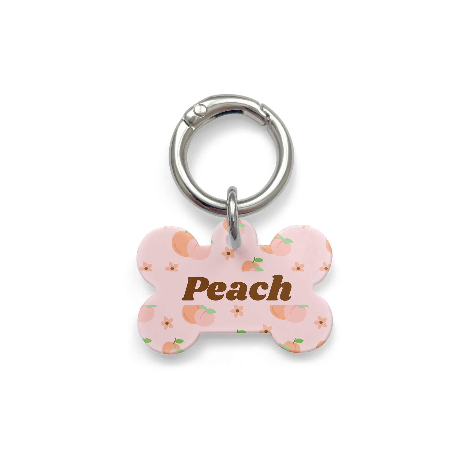 Peach styled Pet ID tag in a bone shape with a silver ring. 