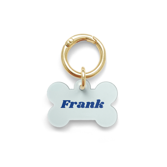 Blue Pet ID Tag in a bone shape with a gold ring.