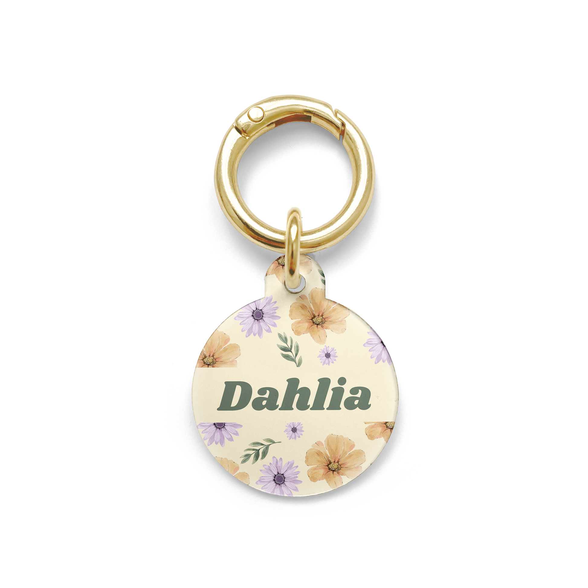 Summer flowers with purple and orange hues spread on a circular shaped pet ID tag with a gold ring.