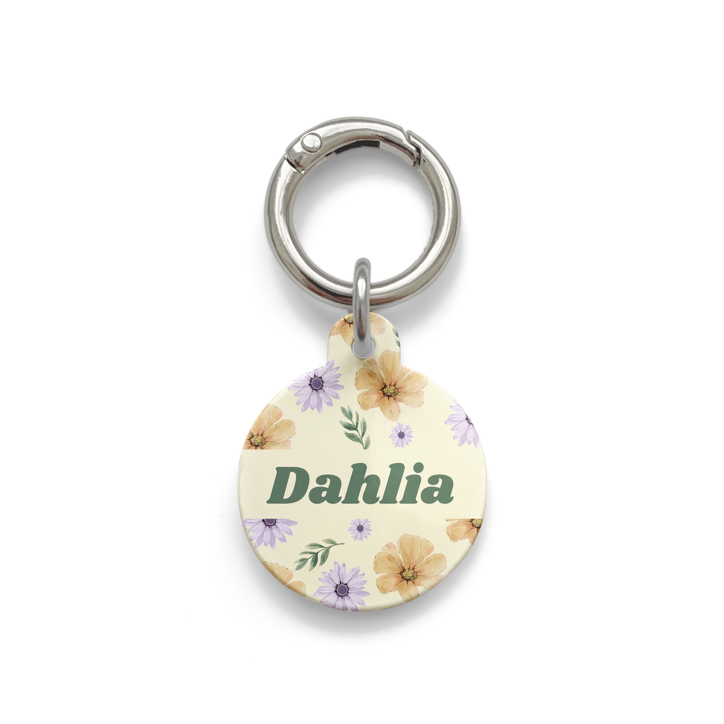 Summer flowers with purple and orange hues spread on a circular shaped pet ID tag with a silver ring.