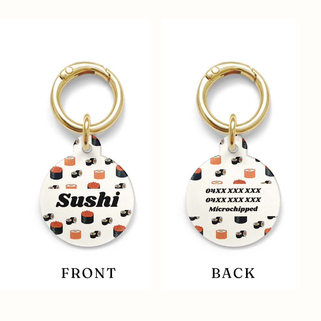 Example of the contact details postioning on a Circle shaped pet ID tag with a design showing various types of sushi with gold ring.